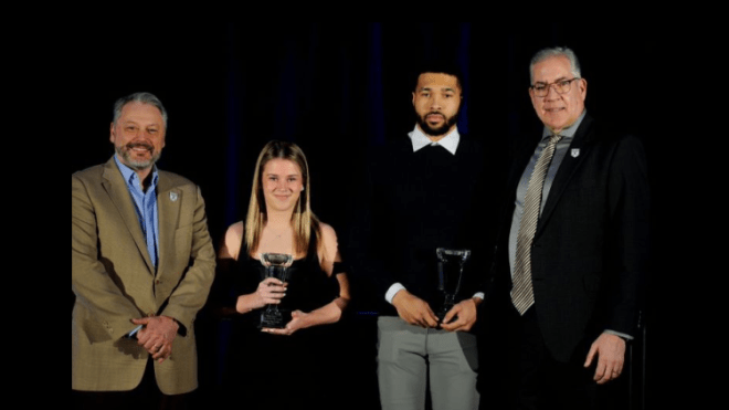 Maggy Burbidge (second left) and David Muenkat (second right) were named the 2023 StFX student-athletes of the year. They are pictured here with StFX President Dr. Andy Hakin (left) and StFX Director of Athletics and Recreation Leo MacPherson 