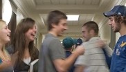 Students joking around in the school hallway